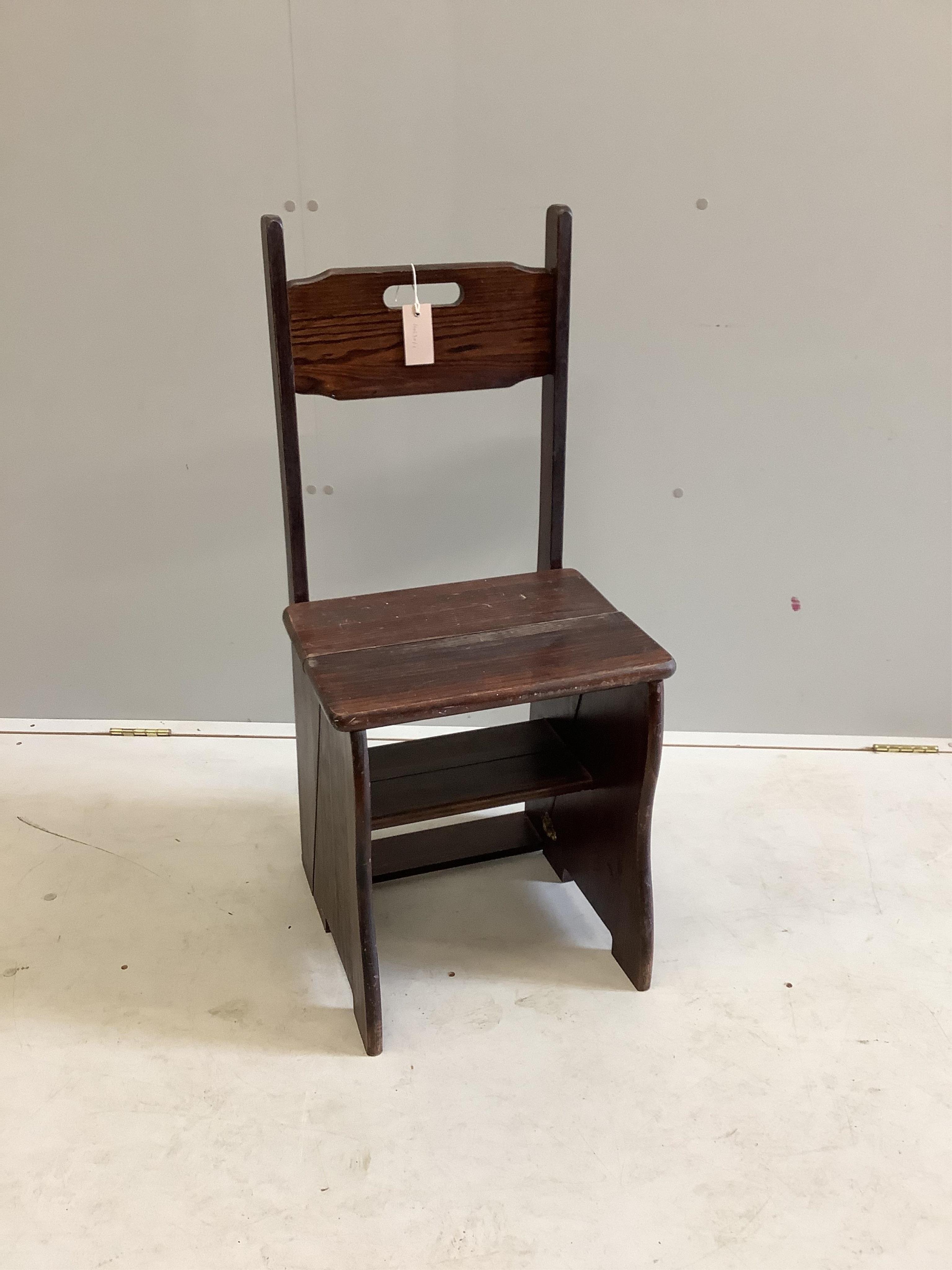 A stained pine metamorphic library chair, width 41cm, depth 36cm, height 92cm. Condition - fair